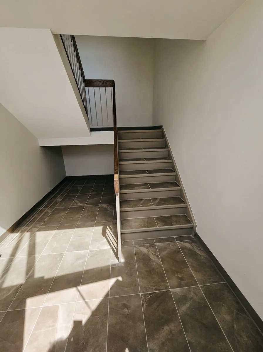 Rebuilt commercial stairwell with new rail and tile